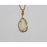 14ct gold and good colour solid opal set with diamond in surround, on gilt metal chain