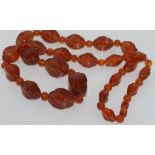 Vintage Baltic graduated honey amber necklace with long and round beads and amber clasp, would