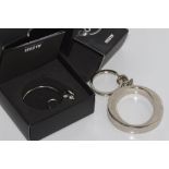 Boxed Alessi 'Pip" mouse keyring together with an Oroton key ring
