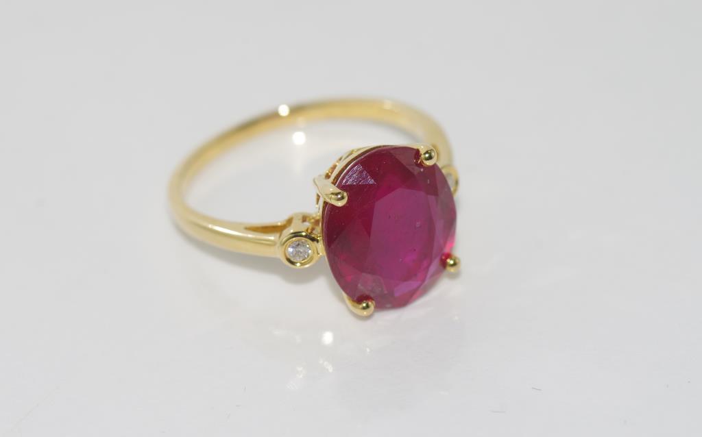 18ct yellow gold, ruby and diamond ring ruby = 5.24cts, 2 diamonds = .04ct, weight: approx 3.3 - Image 2 of 2