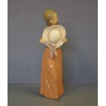 Lladro girl holding a sun hat figurine 25cm high