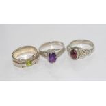 Three various stone set rings peridot, amethyst and garnet