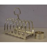 Sterling silver napkin ring and a silver plated toast rack by James Dixon