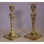 Pair of sterling silver candlesticks hallmarked London, with raised bow and urn decoration, H30cm