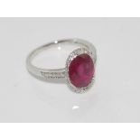 18ct white gold, ruby and diamond ring ruby = 3.42 cts, diamonds = .11 ct, weight: approx 2.9 grams,