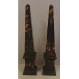 Pair of black figured marble obelisks 45cm high approx.