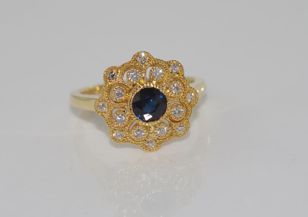 18ct yellow gold, sapphire and diamond dress ring sapphire = 1.5 ct, diamonds = 26 points, weight: