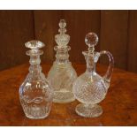 Three 19th century cut glass decanters 2 with replacement stoppers, 33cm high (tallest)