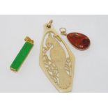 Vintage carved ivory bird pendant with two other pendants