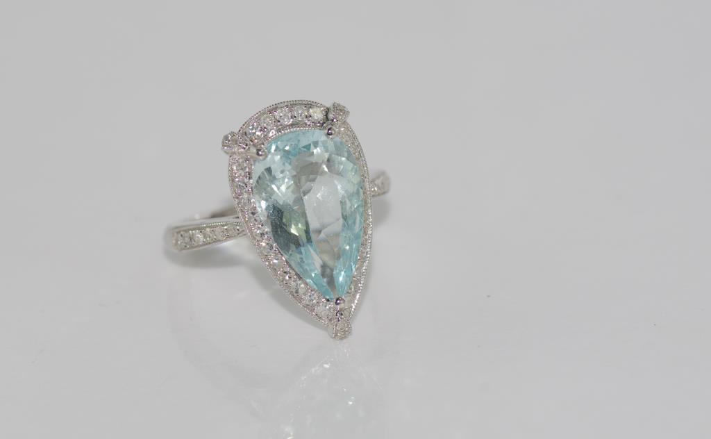 18ct white gold, aquamarine and diamond ring pear shaped aquamarine = 4.25ct, diamonds = 46