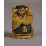 Antique Japanese ivory netsuke depicting a man holding a musical instrument, 5cm high approx. NB