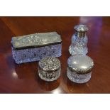 Four various sterling silver lidded crystal jars 10 cm long (largest)