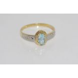 10ct yellow gold ring with blue topaz and diamond weight: approx 1.19 grams, size: O-P/7