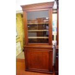 Edwardian walnut elevated bookcase with glass panel door and carved timber panel door, 92cm wide,