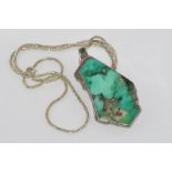 Semi-precious stone pendant on silver necklace