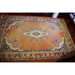 Persian style rug with peach colour tones, 290cm x 192cm approx