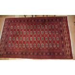 Bokhara wool rug with red tones, 300cm x 185cm approx