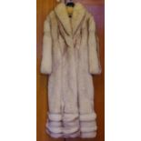 Arctic fox opera length fur coat with roll collar, hidden side pockets and hook fastening, with