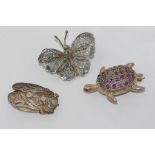 Silver filigree cicada and butterfly brooches with a turtle brooch