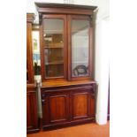 Victorian cedar elevated bookcase with 2 glassed doors over a long drawer and 2 timber panel