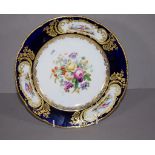 Good 18th century Serves plate with dark blue border, central floral spray, gilded border panels