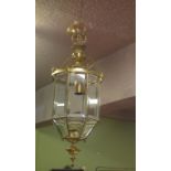 Brass ceiling hall lantern with faceted bevelled glass sides,