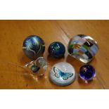 Five various glass paperweights & a glass bird figure, two are signed to base, 6.5 cm high (bird)