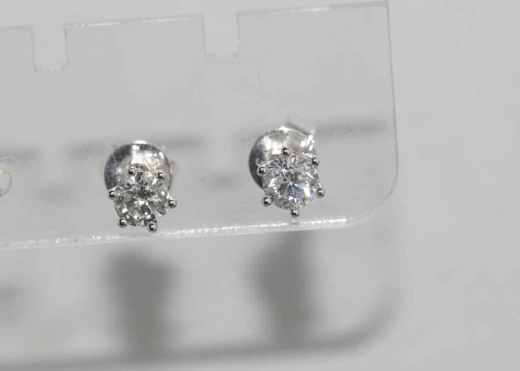 9ct white gold diamond studs each diamond 4 claw set, total = 0.50cts, H /Si 2