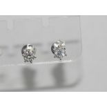 9ct white gold diamond studs each diamond 4 claw set, total = 0.50cts, H /Si 2