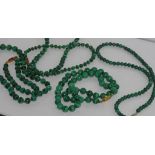 Four various short malachite necklaces