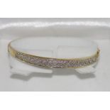 9ct yellow gold and diamond hinged bangle weight: approx 9.95 grams