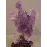 Chinese amethyst figural group on timber stand two attendants with elaborate head dress carrying