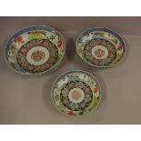 Three graduated Japanese porcelain bowls 24.5cm diameter (largest), the medium sized bowl with