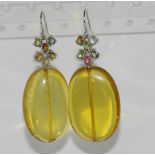 Baltic honey coloured amber earrings with tourmaline set fittings and 9ct gold hooks