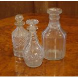 Three Georgian cut glass decanters one missing stopper, 22cm high (tallest)