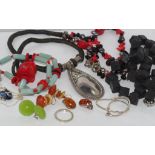 Various necklaces and earrings and a bracelet, most with silver marks