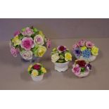 Five floral encrusted china ornaments to include Aynsley and Coalport