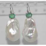 Large baroque pearl and emerald earrings on 9ct white gold hooks