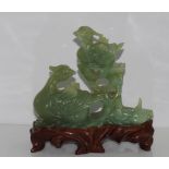 Oriental green jade duck figure on wooden base approx 13cm high