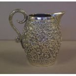 Antique Eastern repoussé silver creamer jug 7.8cm high, 120 grams