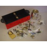 Box of assorted military badges and buttons together with a RAF silver plated cup