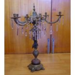 Large brass & metal six branch candelabrum with crystal drops and centre cherub decoration, 75 cm