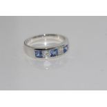 18ct white gold inline sapphire & diamond ring set with 3 princess cut Ceylon sapphire = 0.78ct, 2