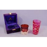 Boxed Edwardian ruby presentation mug 7 cm high, together with an antique ruby glass 11.5 cm high