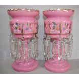 Pair of pink Victorian lustres with gilt and painted decorations, 29cm high approx