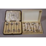 Two cased silver coffee spoon sets comprising of paua shell set marked SILVER and another hallmarked