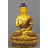 Tibetan gilt bronze seated Buddha figure right hand held symbolizing protection for beings, with