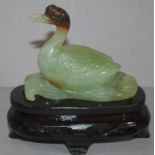 Chinese carved green stone duck figure on carved timber stand, H13.5cm approx