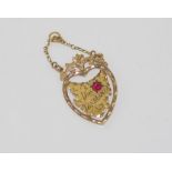 Antique 9ct gold Tasmanian map pendant with red stone, weight: approx 2.29 grams, size: approx 5cm
