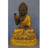 Large Tibetan gilt metal seated figure with right hand held in Abhaya (protection) position, H48cm